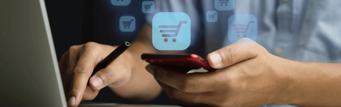 Virtual online shopping cart Man using a mobile phone and laptop with graphic of virtual online shopping cart