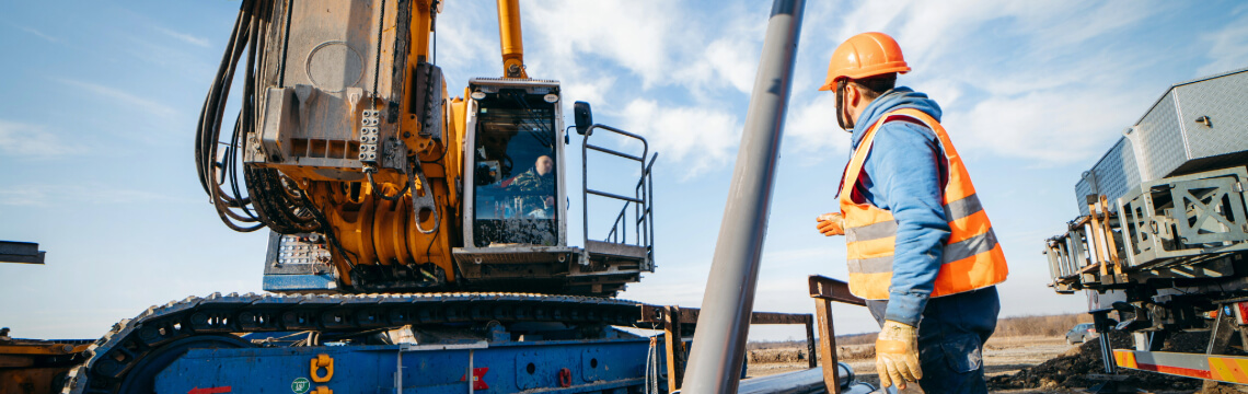 Construction worker operating heavy equipment