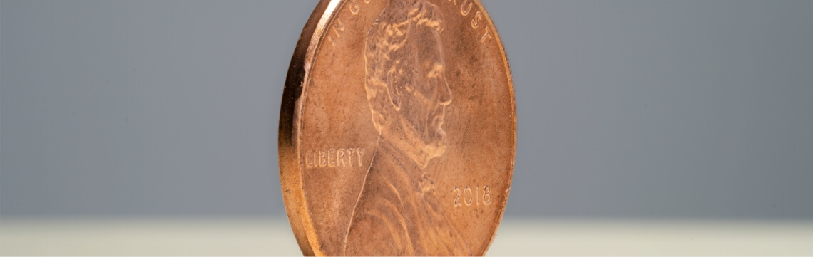 A penny standing on its edge.