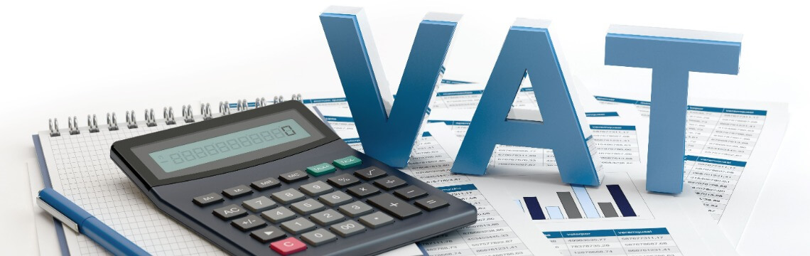 VAT in large letter blocks near a calculator