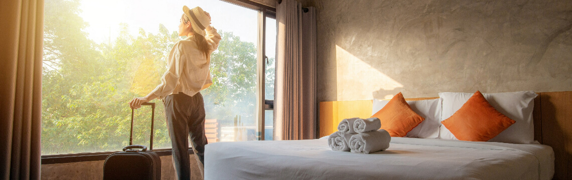 woman with suitcase at hotel