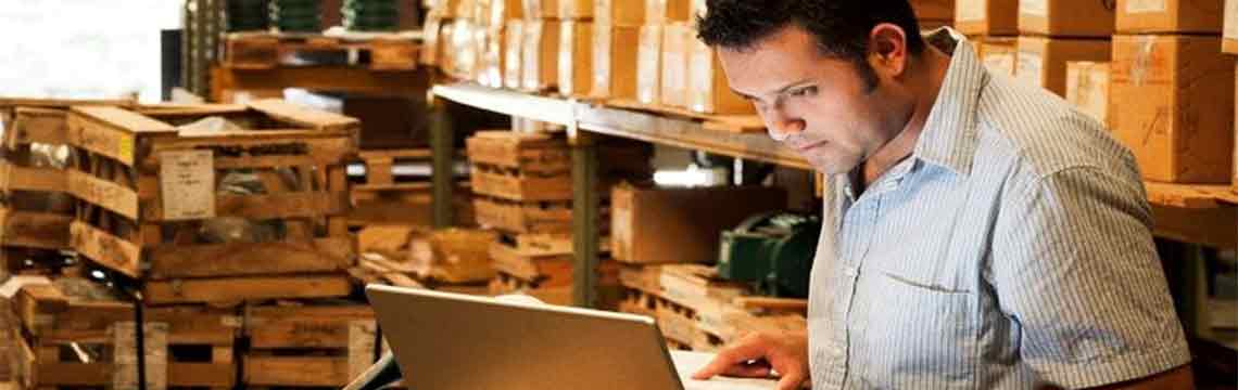 Customs official processing imported packages.